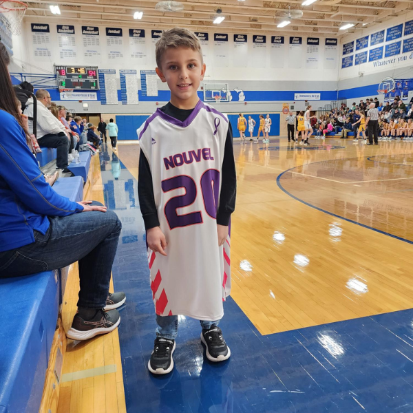 boy in basketball jersey